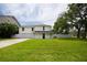 Charming white two-story home with a spacious front yard and attached two car garage at 2807 57Th S St, Gulfport, FL 33707
