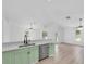Modern kitchen features sleek countertops, stainless steel appliances, and pastel green cabinets at 2807 57Th S St, Gulfport, FL 33707