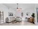 Bright living room with neutral furniture, light-colored wood floors, and modern decor at 2807 57Th S St, Gulfport, FL 33707