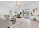 Open-concept living room with cozy seating, stylish decor, and sliding glass doors to the outdoor patio at 2807 57Th S St, Gulfport, FL 33707