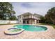 Backyard view of sparkling pool, hot tub, and exterior decks at 2807 57Th S St, Gulfport, FL 33707