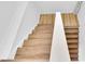 Bright staircase featuring light wood steps and white risers at 2807 57Th S St, Gulfport, FL 33707