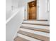 Staircase with a modern lift, offering easy access between floors at 2807 57Th S St, Gulfport, FL 33707