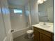 Bright bathroom features a tub-shower combo and a modern vanity with sink at 28547 Hillcrest Valley Blvd, Wesley Chapel, FL 33543
