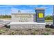 The Persimmon Park at Wiregrass Ranch community sign surrounded by mulch, plants, and green grass on a clear day at 28547 Hillcrest Valley Blvd, Wesley Chapel, FL 33543
