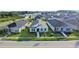 Aerial view of a charming single Gathering home with a modern design and well-maintained landscaping under sunny skies at 28547 Hillcrest Valley Blvd, Wesley Chapel, FL 33543