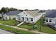Attractive single-story home with a manicured lawn and stone-detailed pillars at 28547 Hillcrest Valley Blvd, Wesley Chapel, FL 33543