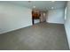Spacious living room featuring tile flooring and an open layout to the kitchen at 28547 Hillcrest Valley Blvd, Wesley Chapel, FL 33543