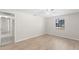 Bedroom with wood flooring, ceiling fan and a view of hallway at 2907 W Tyson Ave, Tampa, FL 33611