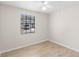 Bedroom featuring wood flooring, ceiling fan and a sunny window at 2907 W Tyson Ave, Tampa, FL 33611