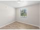 Sunny bedroom featuring wood flooring and a bright window at 2907 W Tyson Ave, Tampa, FL 33611