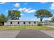 Charming single-story home featuring a well-maintained lawn, carport and beautiful mature trees at 2907 W Tyson Ave, Tampa, FL 33611