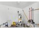 Spacious garage area featuring a water heater and space for storage and tools at 2907 W Tyson Ave, Tampa, FL 33611