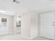 Clean and modern kitchenette with white cabinetry, tile floors and modern fixtures at 2907 W Tyson Ave, Tampa, FL 33611