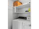 Functional laundry area features a washer and dryer for convenient home cleaning at 2907 W Tyson Ave, Tampa, FL 33611