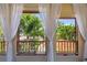Charming balcony with views of tropical foliage and a serene atmosphere, ideal for enjoying the outdoors at 3112 W Wallcraft Ave, Tampa, FL 33611