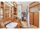 This bathroom features custom wood cabinets, a vessel sink, and wood floors at 3112 W Wallcraft Ave, Tampa, FL 33611