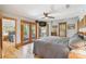 Bright and airy bedroom with hardwood floors and French doors leading to a balcony at 3112 W Wallcraft Ave, Tampa, FL 33611