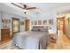 Inviting bedroom showcasing hardwood floors, ample natural light, and tasteful décor, perfect for restful nights at 3112 W Wallcraft Ave, Tampa, FL 33611