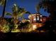 A beautiful home at dusk with lush landscaping at 3112 W Wallcraft Ave, Tampa, FL 33611