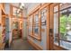 Inviting foyer with craftsman trim, tile floor, and views to the bath and exterior at 3112 W Wallcraft Ave, Tampa, FL 33611