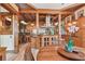 Beautifully appointed kitchen featuring wood accents, granite countertops, and a functional island with seating at 3112 W Wallcraft Ave, Tampa, FL 33611