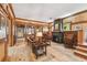 Spacious living room with hardwood floors, stone fireplace, and natural wood trim at 3112 W Wallcraft Ave, Tampa, FL 33611