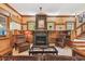 Warm and inviting living room featuring a cozy fireplace and rustic wood accents at 3112 W Wallcraft Ave, Tampa, FL 33611