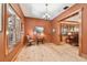 Office space with hardwood floors, natural light, and convenient access to living room at 3112 W Wallcraft Ave, Tampa, FL 33611