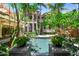 Lush backyard oasis featuring a beautiful pool and landscaping, perfect for outdoor entertaining and relaxation at 3112 W Wallcraft Ave, Tampa, FL 33611