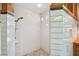 This shower features beautiful white subway tile, mosaic flooring, and natural lighting at 3112 W Wallcraft Ave, Tampa, FL 33611