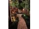 A charming walkway is lined with lush vegetation and leads to a private outdoor seating area at 3112 W Wallcraft Ave, Tampa, FL 33611
