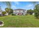 Expansive backyard offering ample space, a patio dining set, and well-maintained lawn at 31747 Loch Aline Dr, Wesley Chapel, FL 33545