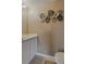 Stylish bathroom with a modern vanity and attractive leaf-themed wall decor at 31747 Loch Aline Dr, Wesley Chapel, FL 33545