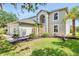 Charming two-story home boasts mature landscaping, a two-car garage, and inviting curb appeal at 31747 Loch Aline Dr, Wesley Chapel, FL 33545