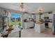 Bright kitchen with butcher block island, white cabinets, stainless steel appliances, and view to the lake at 31747 Loch Aline Dr, Wesley Chapel, FL 33545