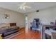 Relaxing living room space with wood laminate floors, with access to kitchen and dining room at 31747 Loch Aline Dr, Wesley Chapel, FL 33545