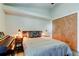 Bedroom featuring wood floors, piano, ceiling fan, and plenty of natural light at 3410 Briarwood Ln, Safety Harbor, FL 34695