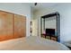 Neutral bedroom featuring closet and entertainment center with dark wood floors at 3410 Briarwood Ln, Safety Harbor, FL 34695