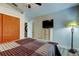 Bedroom featuring a wicker dresser, hardwood flooring, and closet at 3410 Briarwood Ln, Safety Harbor, FL 34695