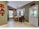 Bright breakfast nook with large windows, cozy seating, and stylish lighting at 3410 Briarwood Ln, Safety Harbor, FL 34695