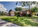 Charming single-story home with well-manicured lawn, mature landscaping, and inviting curb appeal at 3410 Briarwood Ln, Safety Harbor, FL 34695