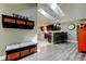 Hallway with a decorative storage bench and a view into the modern kitchen at 3410 Briarwood Ln, Safety Harbor, FL 34695