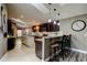 Modern kitchen with granite countertops, stainless steel appliances, and a breakfast bar at 3410 Briarwood Ln, Safety Harbor, FL 34695