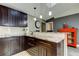 Modern kitchen features dark cabinetry, stylish countertops, and pendant lighting at 3410 Briarwood Ln, Safety Harbor, FL 34695