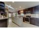 Modern kitchen with stainless steel appliances, granite countertops, and an island at 3410 Briarwood Ln, Safety Harbor, FL 34695
