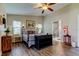 Comfortable main bedroom with natural lighting and sleek hardwood floors at 3410 Briarwood Ln, Safety Harbor, FL 34695