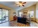 Spacious main bedroom featuring a sliding glass door and wood flooring at 3410 Briarwood Ln, Safety Harbor, FL 34695