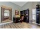 Home office area with a desk, built-in shelving, and natural light at 3410 Briarwood Ln, Safety Harbor, FL 34695