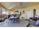 Enclosed patio with outdoor seating and string lights, perfect for entertaining at 3410 Briarwood Ln, Safety Harbor, FL 34695